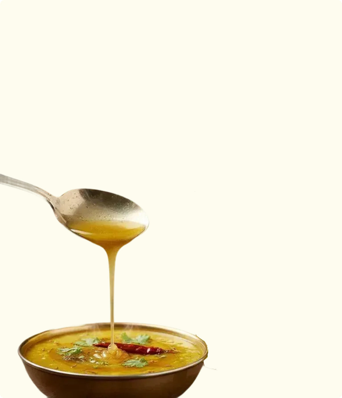 Brijka A2 ghee being served on a traditional family thali with fresh roti.